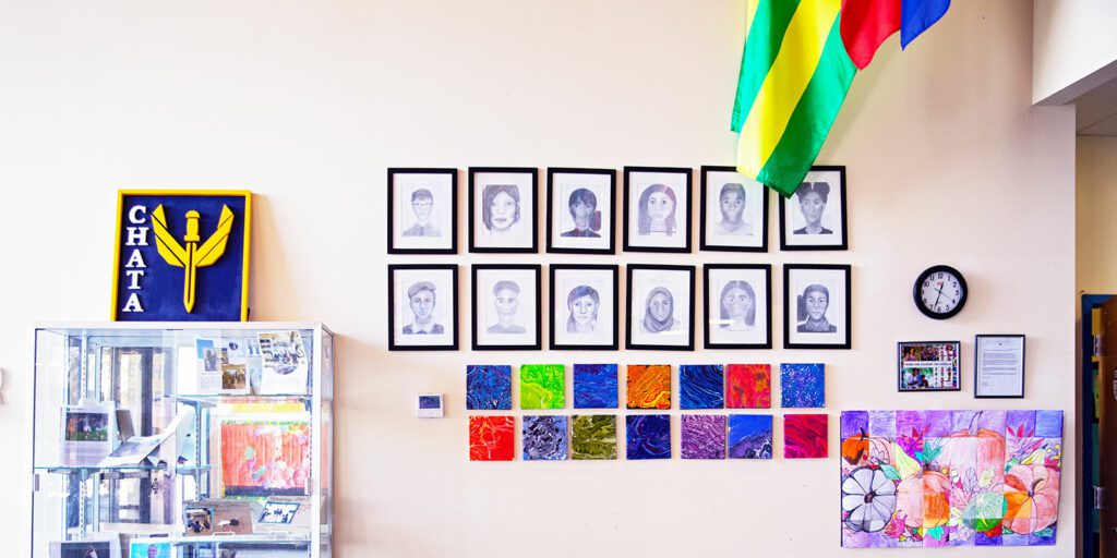 Student artwork displayed on the wall at CHATA.