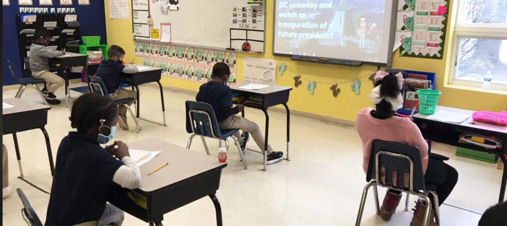 Students at desks in a classroom